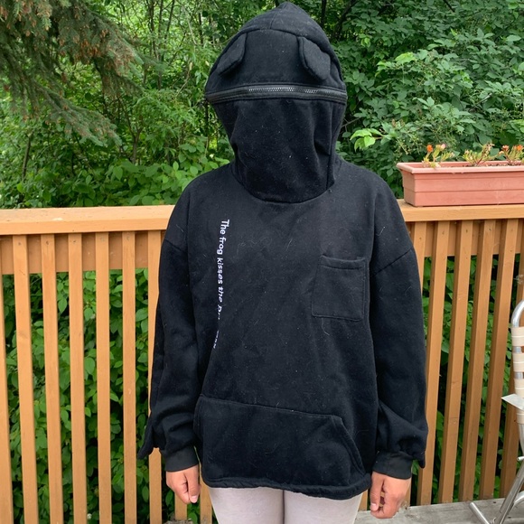 A frog hoodie that has the words “the frog kisses the princess” on it. - Picture 4 of 5